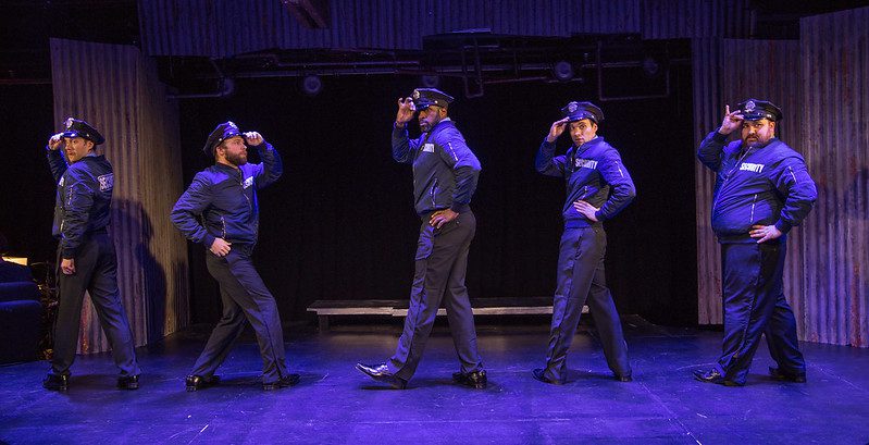 Police officers dancing together